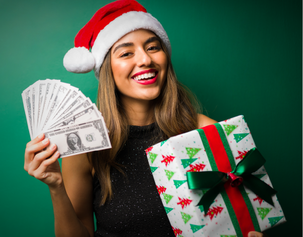 a woman holding a present and cash