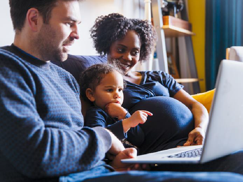 A man and woman with a child. 