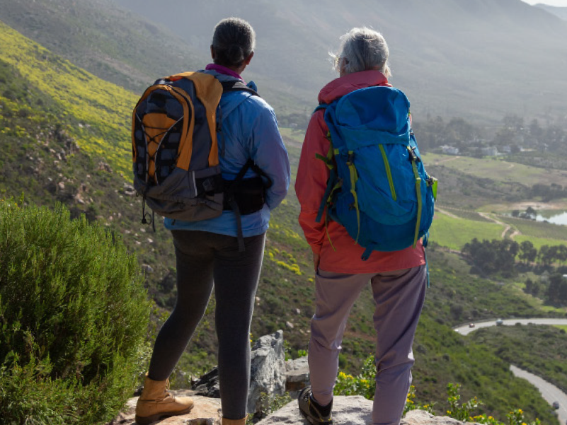 Two friends hiking in the mountains. 