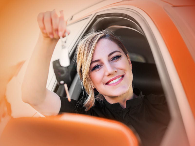 New car keys handed to an AFCU member after auto loan funding