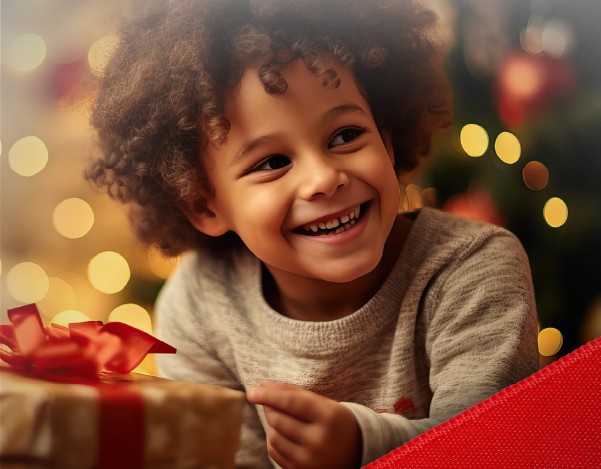 a child holding a christmas present