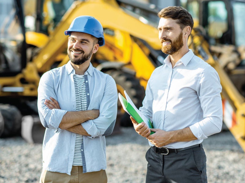 Two men at a construction site