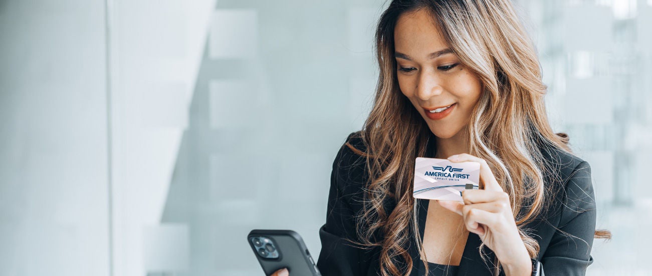 Woman holding a visa card