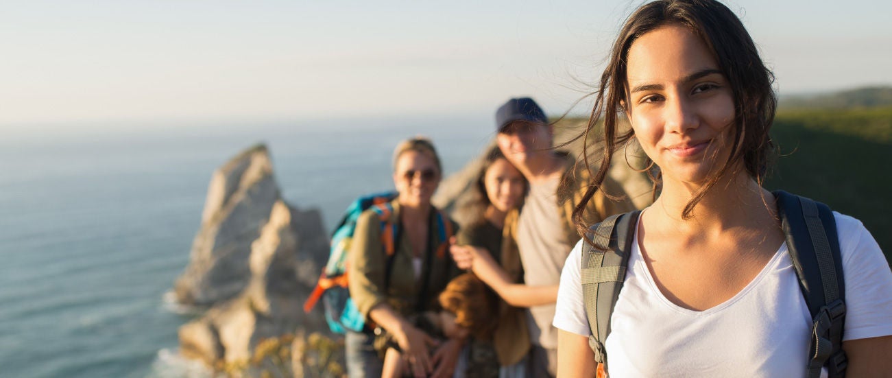 A group of teenagers hiking.