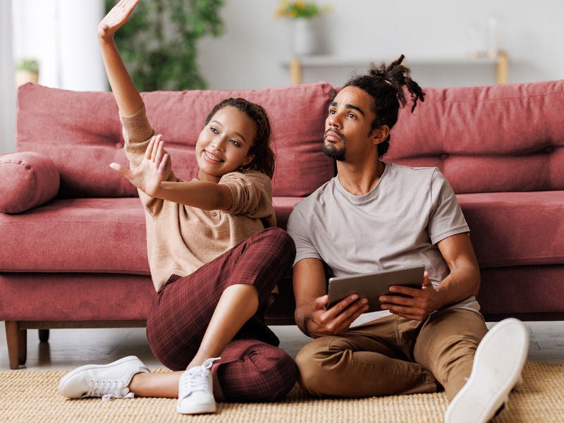 a man and woman planning renovations on their home.