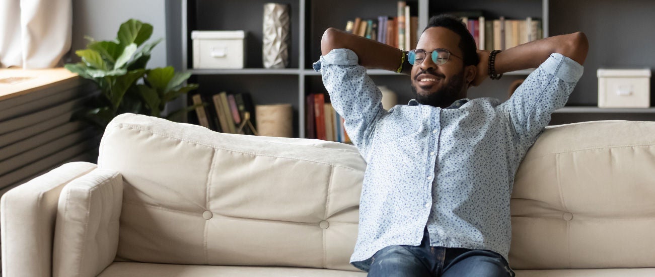 A man relaxing on the couch. 