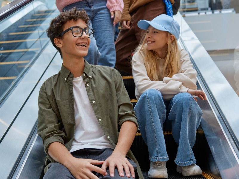 Teenagers sitting on the stairs.