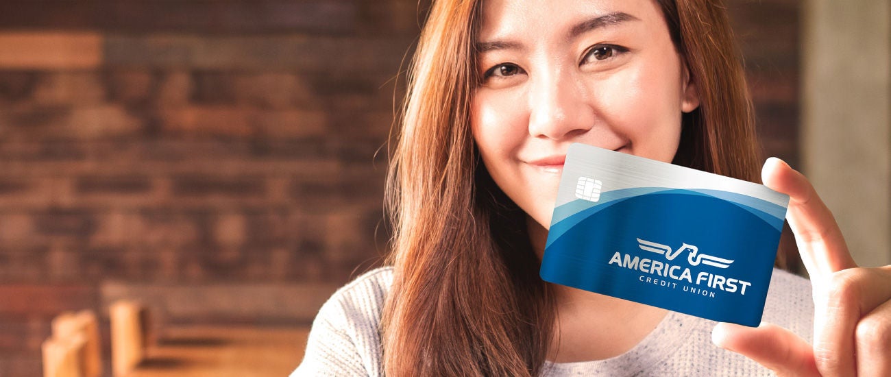 Woman holding a credit card