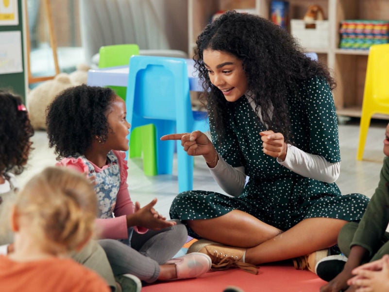 A teacher interacting with her students.