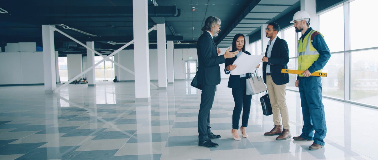 Four people inside a building