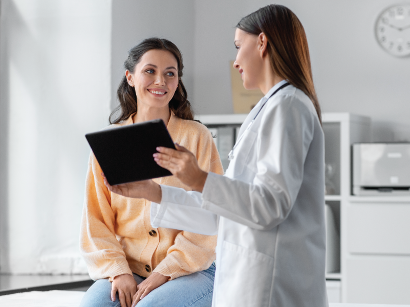 A doctor and patient consulting one another. 