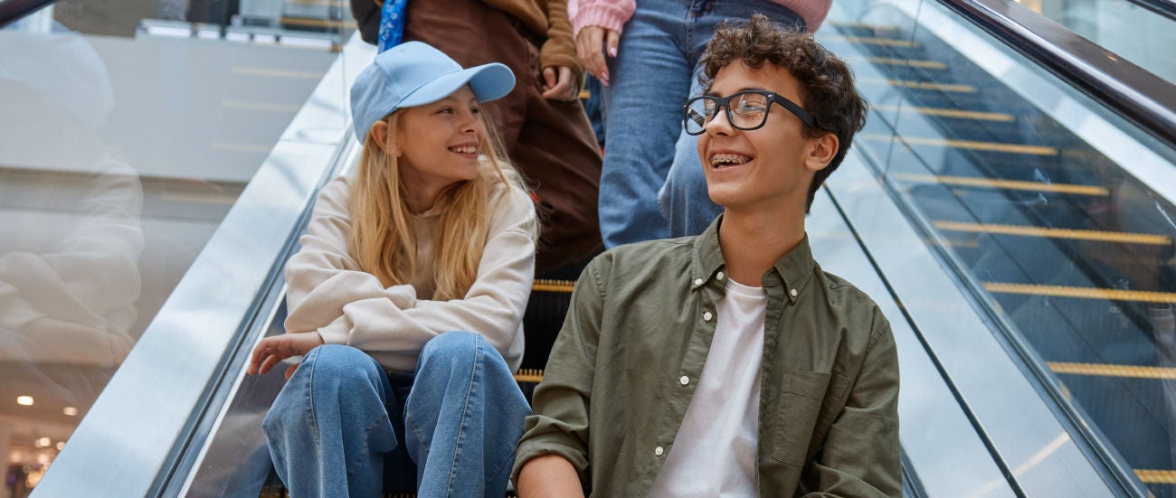 Teenagers sitting on the stairs.