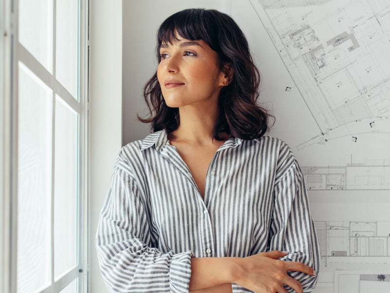 a woman looking out a window