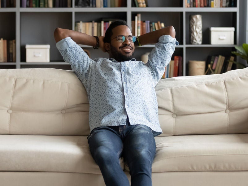 A man relaxing on the couch. 