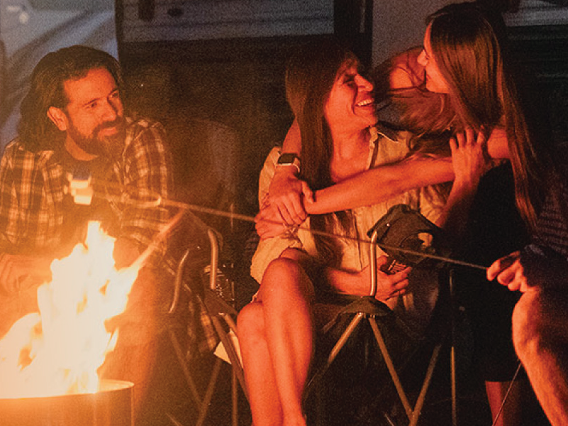 An image of a family enjoying a campfire.