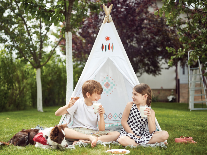 Children playing in a teepee