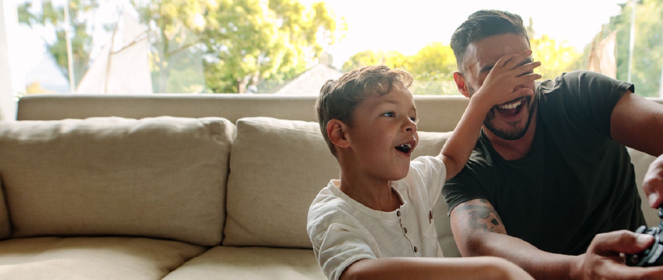 a father and son playing videogames