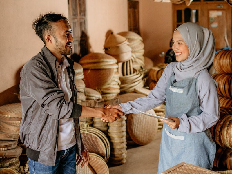 a man and woman shaking hands