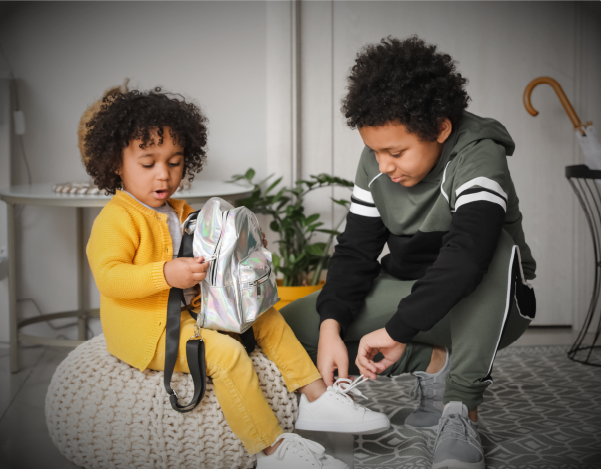children putting on shoes