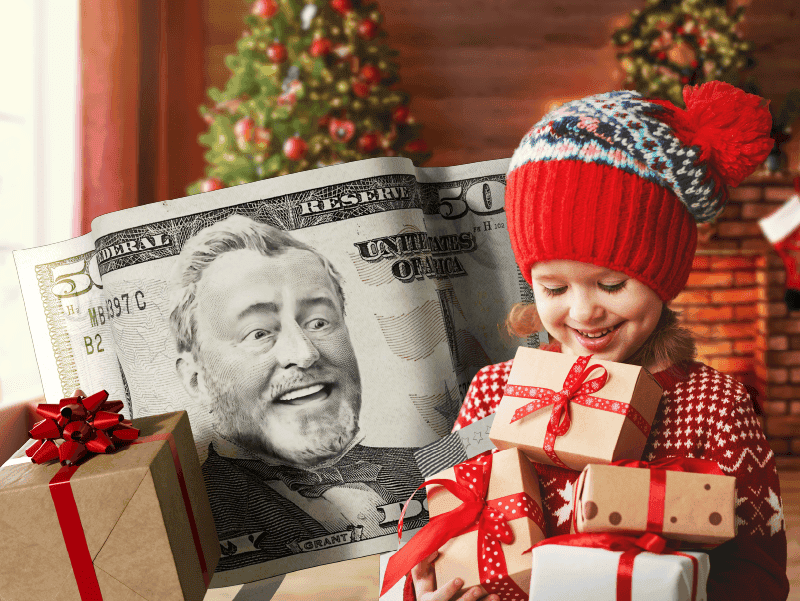 An image of a little girl holding a stack of Christmas gifts. 