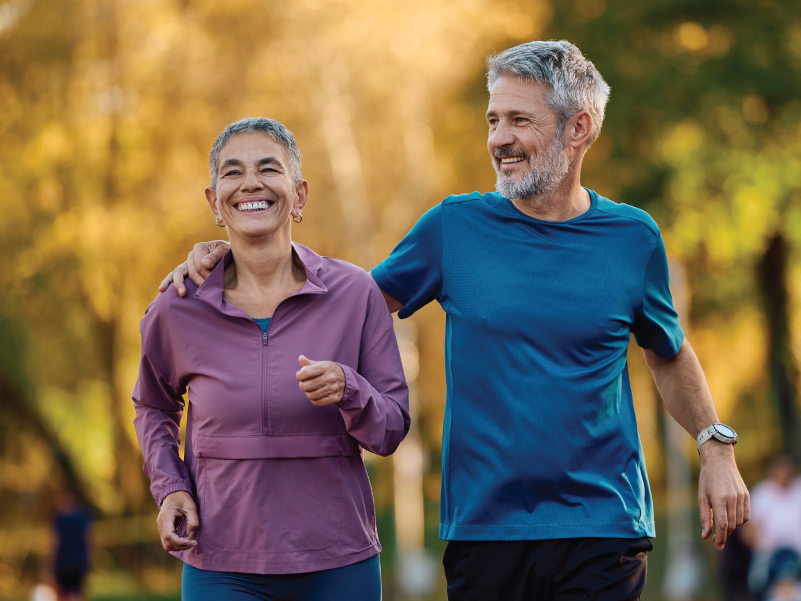 Two people exercising outdoors. 