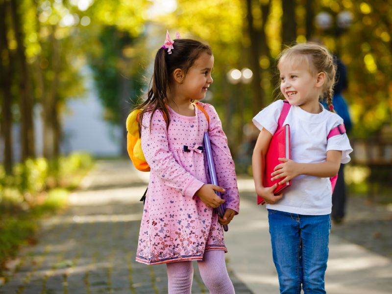 Two young girls on their way to school.